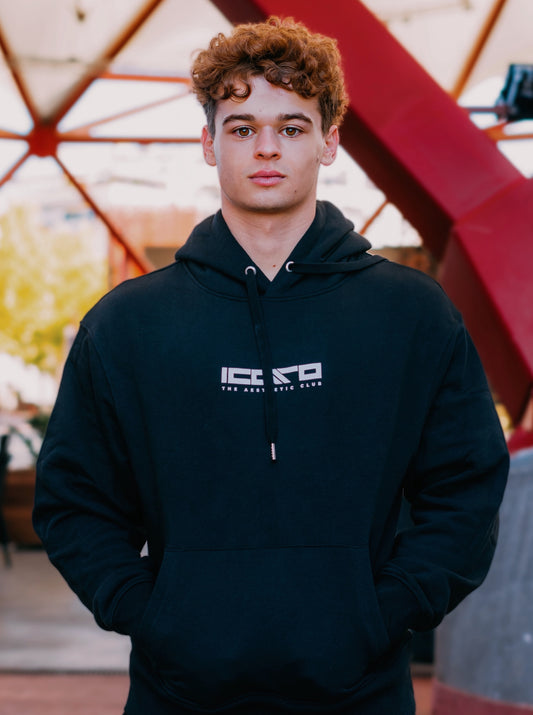 Hoodie oversize ÍCARO 0% Motivation 100% Discipline negro, vista frontal.